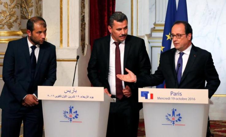 President of the Syrian White Helmets Raed Saleh, Brita Hagi Hassan, president of the city council for opposition-held Aleppo, and French President Hollande hold a joint news statement after a meeting at the Elysee Palace in Paris